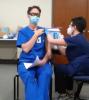 RN Rob Wells gets his first round of the COVID vaccine from coworker RN Sandi Rude - 12-22-20 - Submitted photo